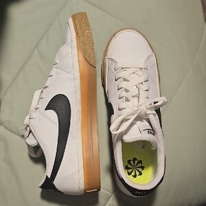 Nike White Sneakers with Black Swoosh and Gum Sole